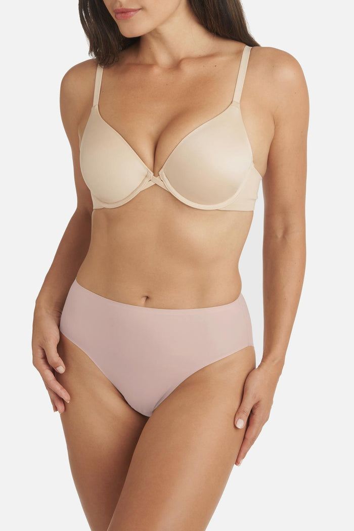 Woman wearing a light pink colored shaping panty