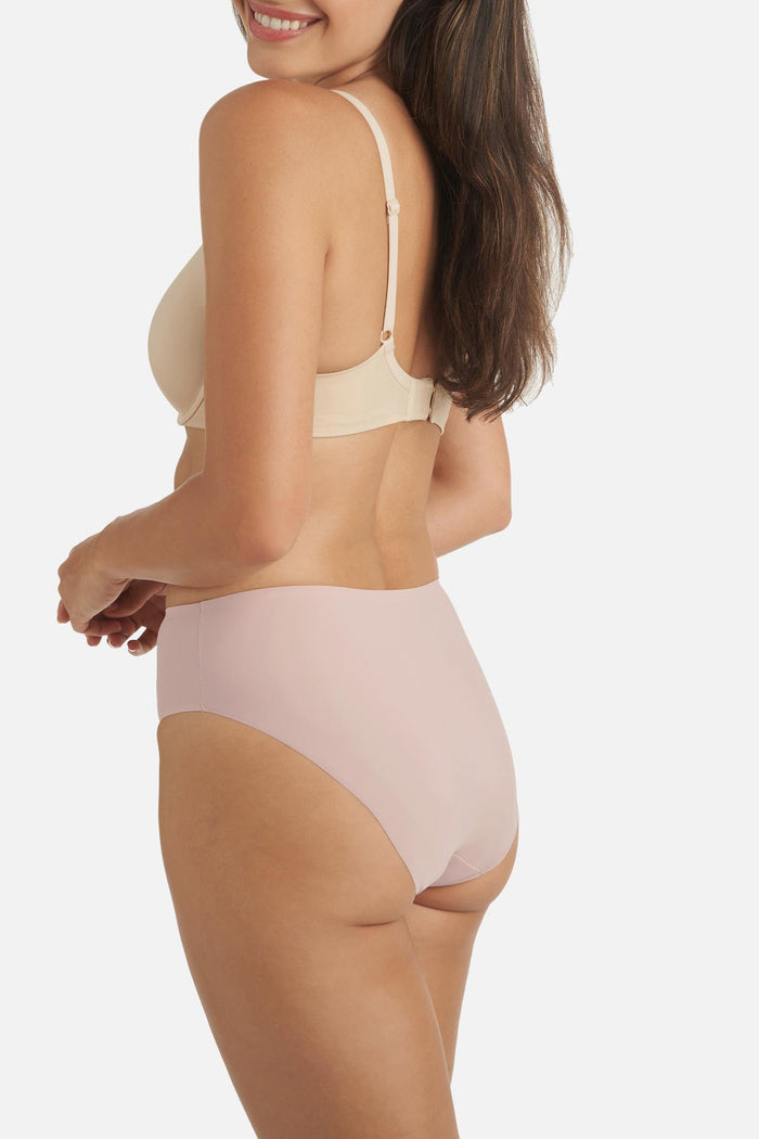 Woman turned left wearing a light pink colored shaping panty