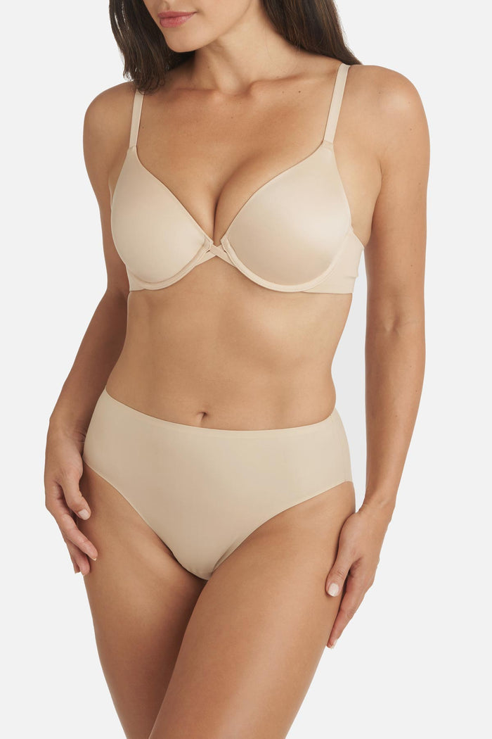 Woman wearing a tan colored shaping panty