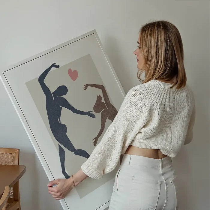 Dancers Watercolour Style Print held up against a living room wall