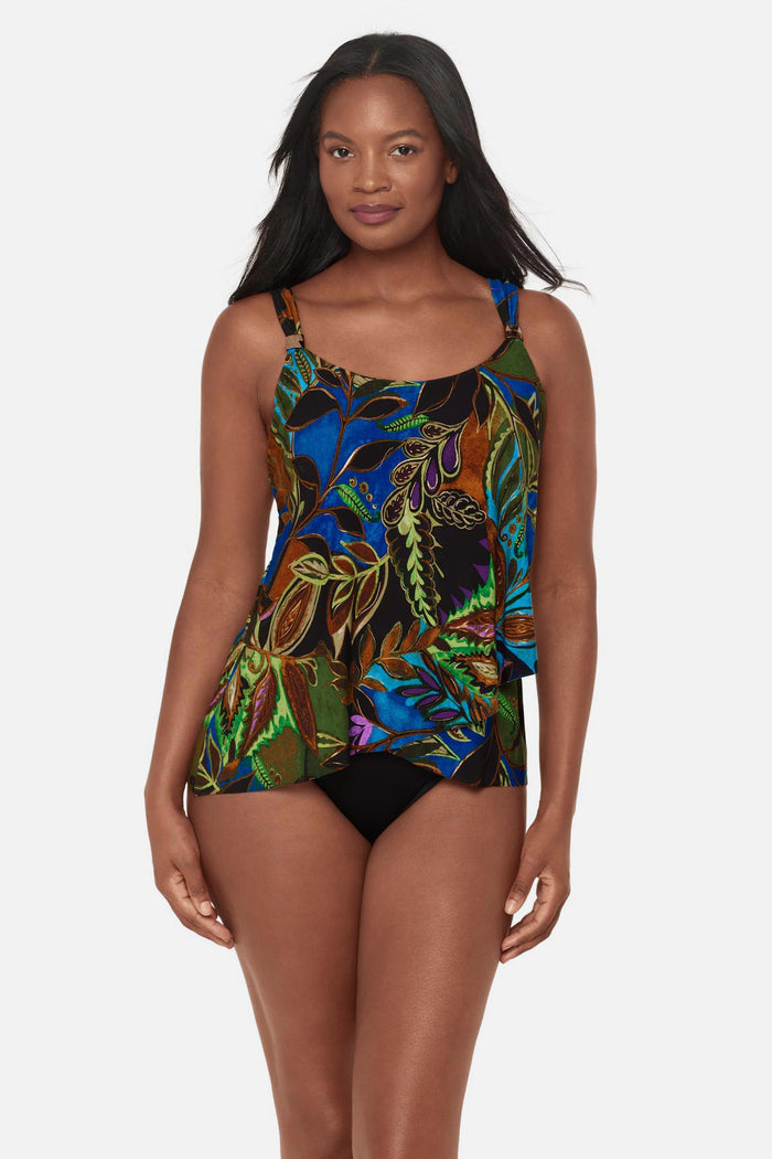Woman wearing a multicolored tropical print tankini top