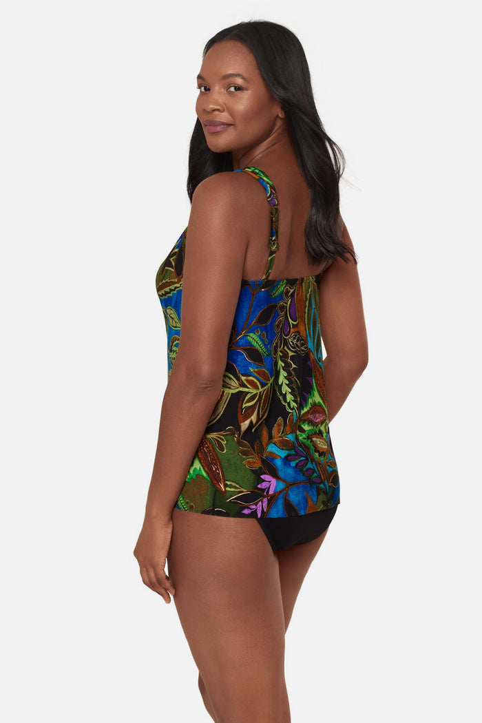 Woman turned left wearing a multicolored tropical print tankini top