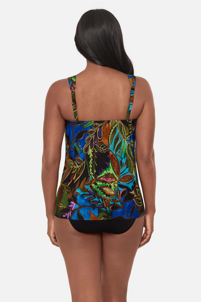 Woman turned away wearing a multicolored tropical print tankini top