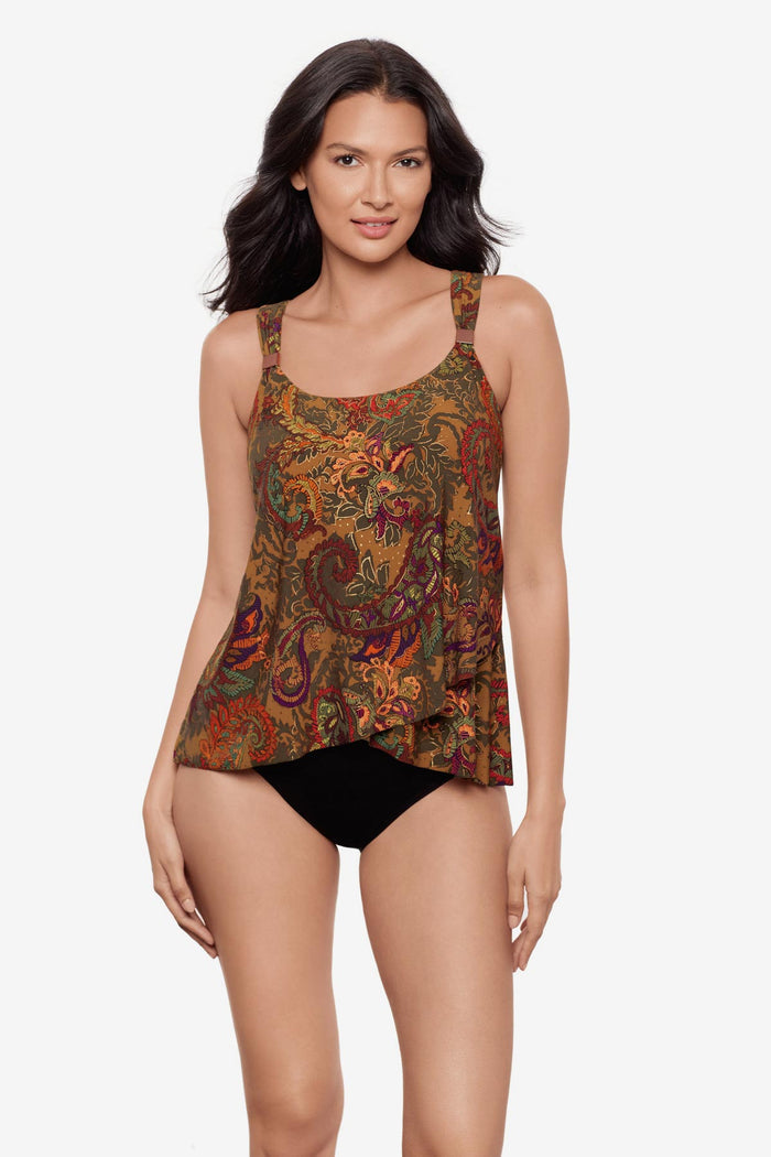 Woman wearing a multicolored paisley printed tankini top with details on the straps