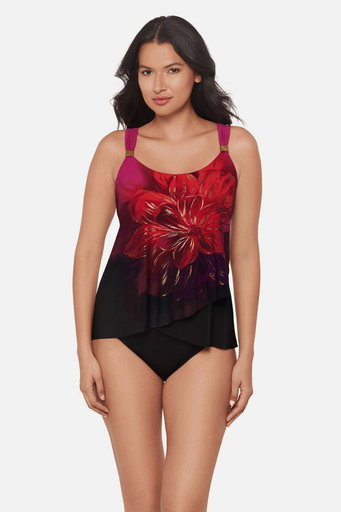 Woman wearing a red, purple and pink floral printed tankini top