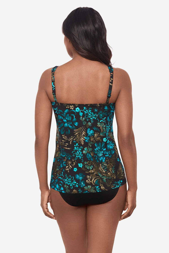 Woman facing away wearing a multicolor tankini top
