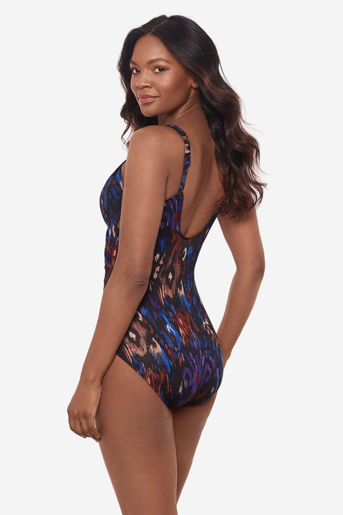 Woman turned left showing off side of one-piece multicolored