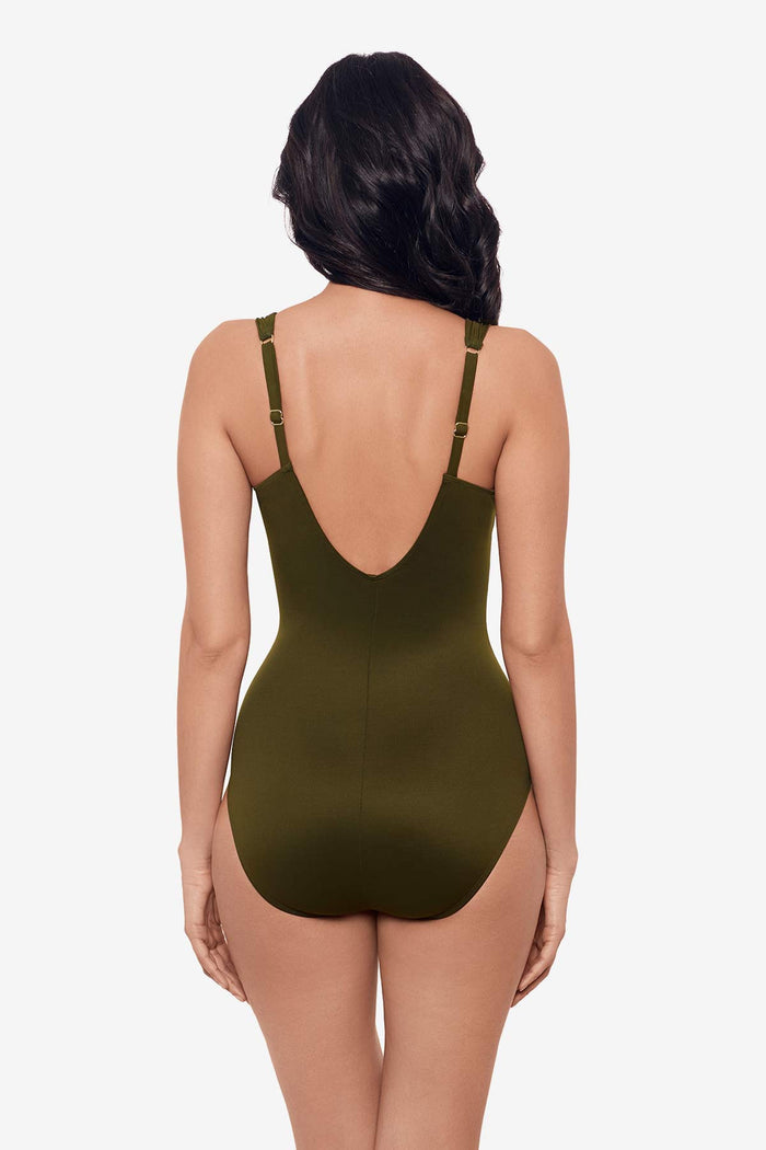 Woman facing away  wearing a nori green one-piece swimsuit