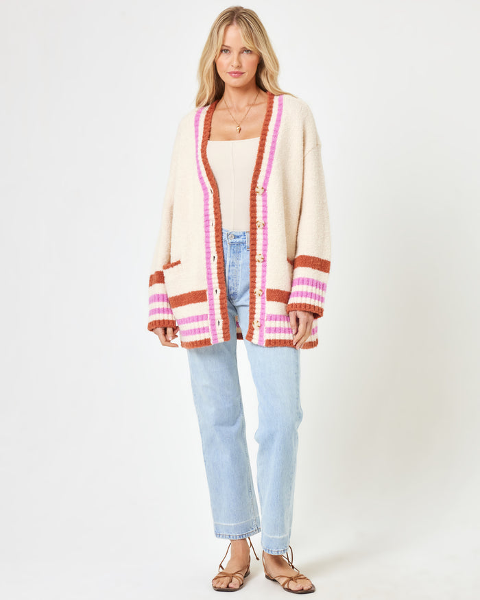 Front view of a model wearing the LSPACE Delta Blooms Sweater in delta blooms jacquard, showing the relaxed-fit floral knit pullover with dropped shoulders and ribbed hem.