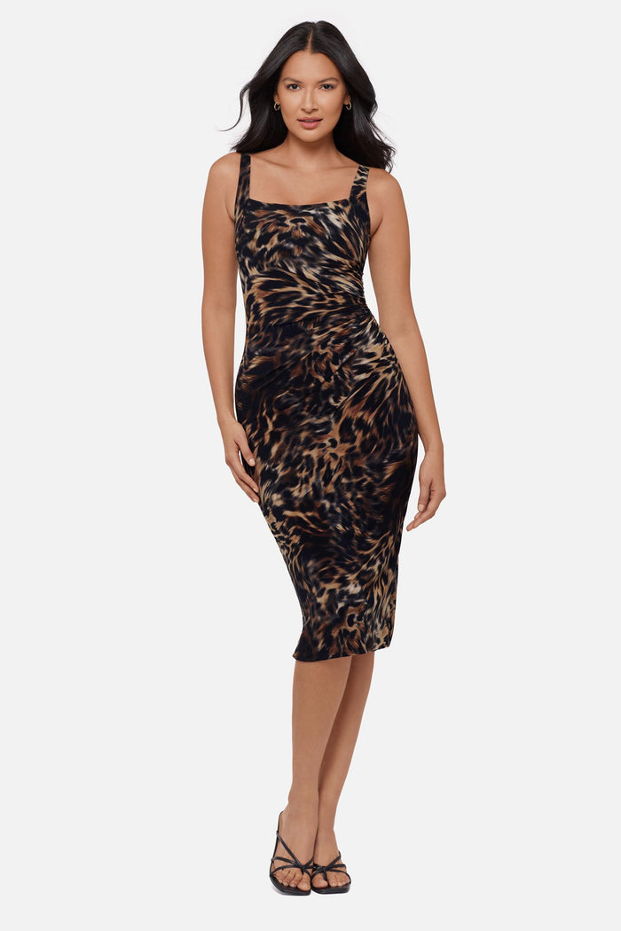 Woman wearing an animal printed sleeveless mid length dress