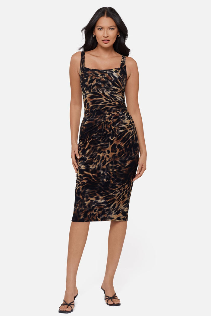 Woman wearing an animal printed sleeveless mid length dress