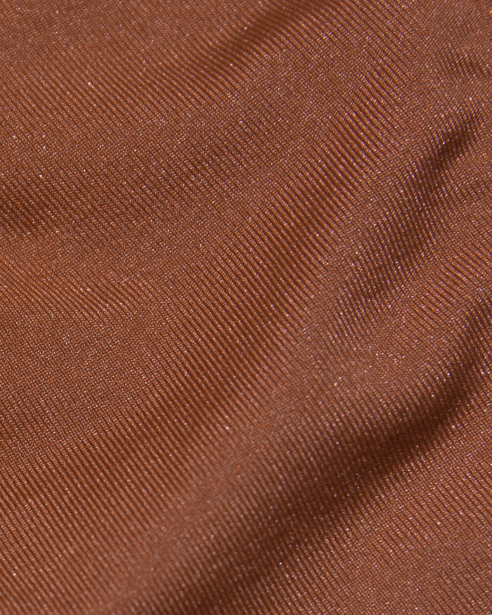 Close-up detail of the tobacco shimmer fabric texture of the LSPACE Donnie Bikini Bottom, showing a fine diagonal weave with subtle metallic sheen.