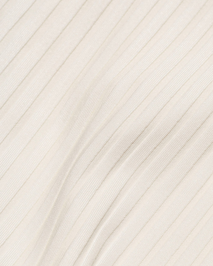 Close-up detail of the cream ribbed eco-friendly fabric texture of the LSPACE Effie Bikini Top, off-model.