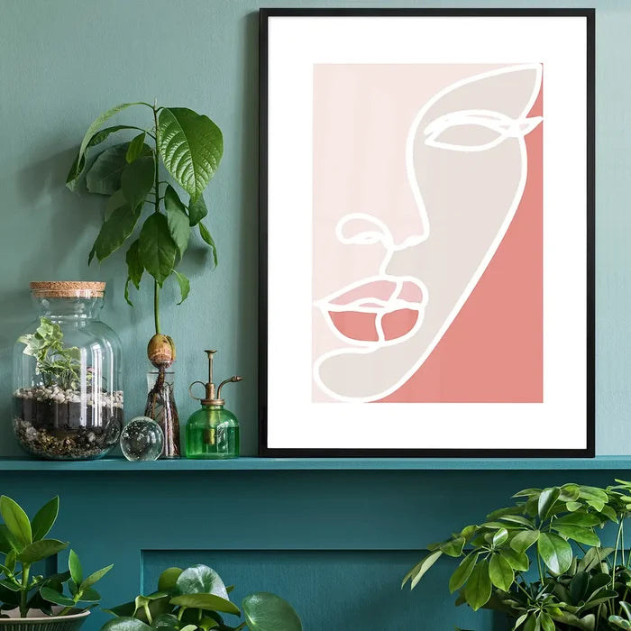 Face Study Block Colours Print black framed on a living room shelf