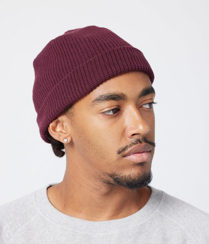 Burgundy beanie on model (side)
