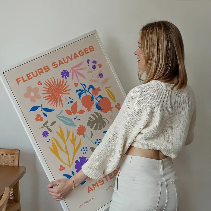 Fleurs Sauvages Amsterdam Flower Print held up against a living room wall