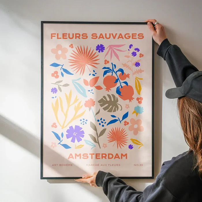 Fleurs Sauvages Amsterdam Flower Print being hung on a wall in a black frame
