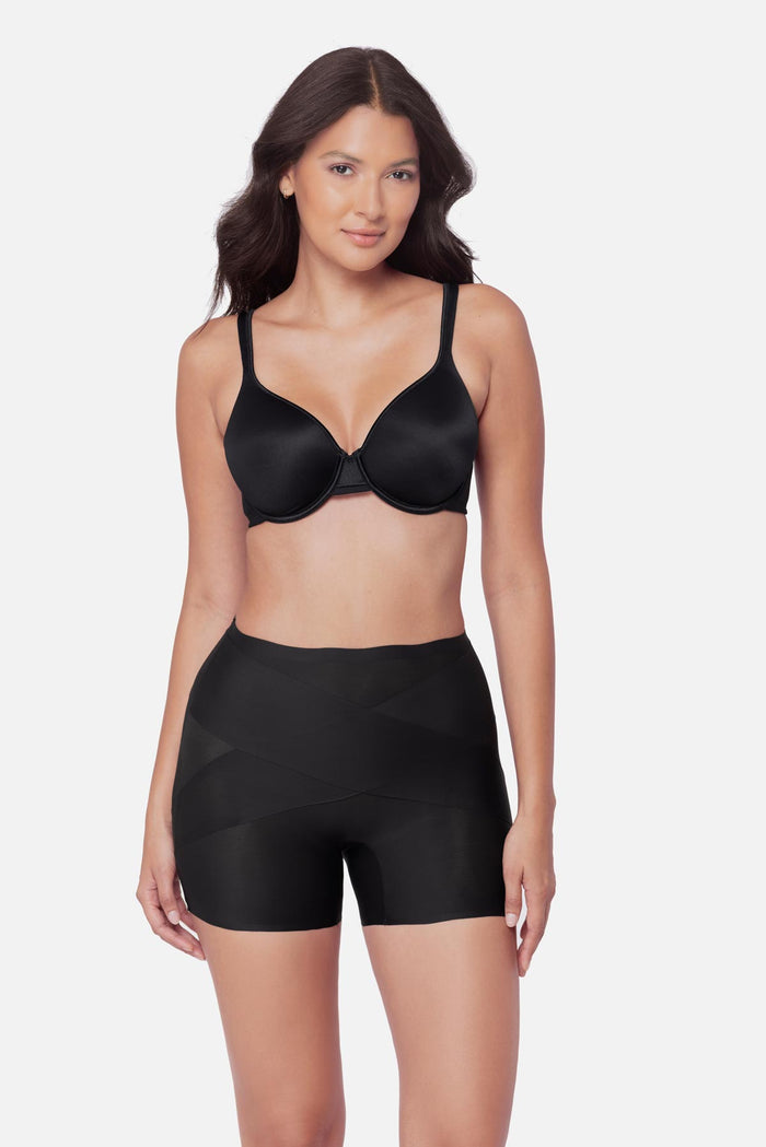 Woman wearing a black boy short shapewear pant