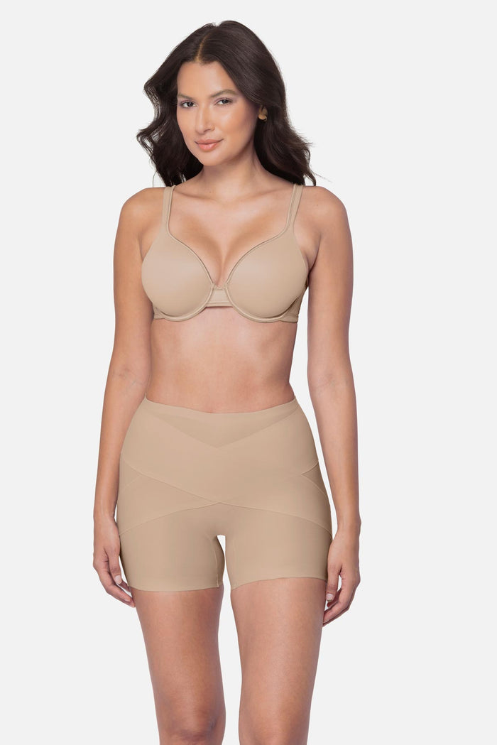 Woman wearing a beige boy short shapewear pant