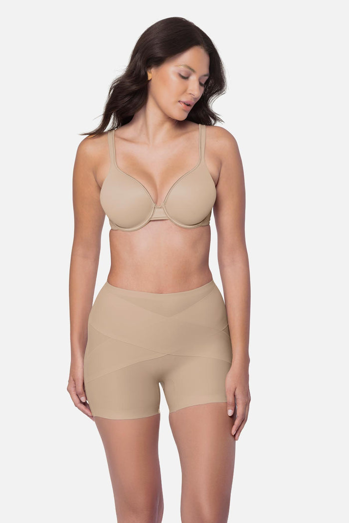Woman wearing a beige boy short shapewear pant
