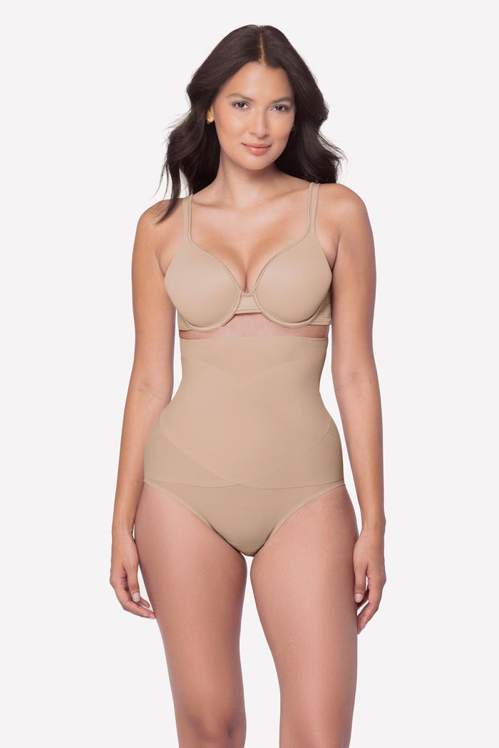 Woman wearing a beige high waisted brief shapewear