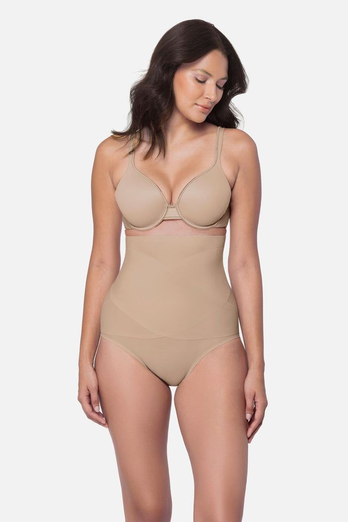 Woman wearing a beige high waisted brief shapewear