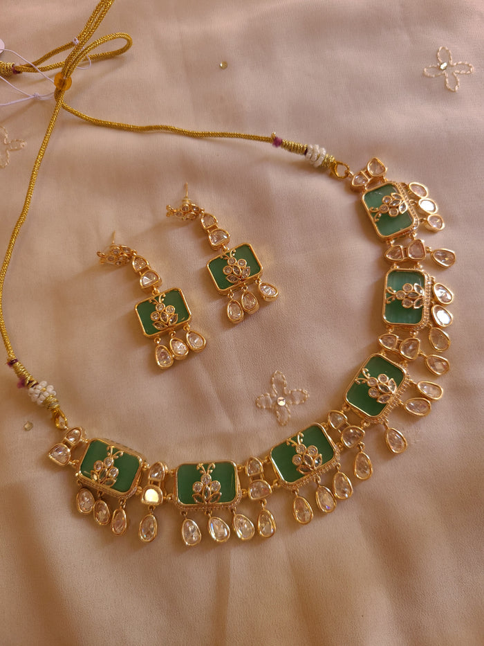 MOHAR Kundan-style choker set in green stones with gold-finish base