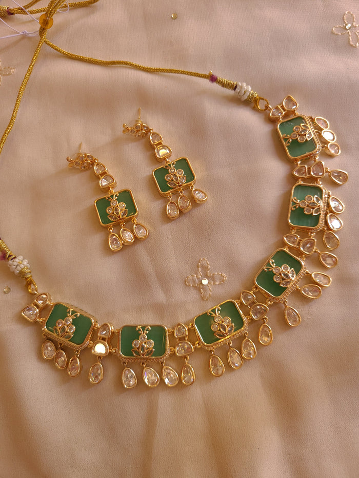 MOHAR Kundan-style choker set in green stones with gold-finish base