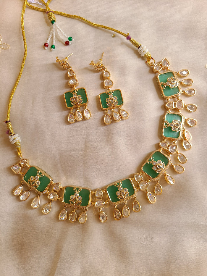 MOHAR Kundan-style choker set in green stones with gold-finish base