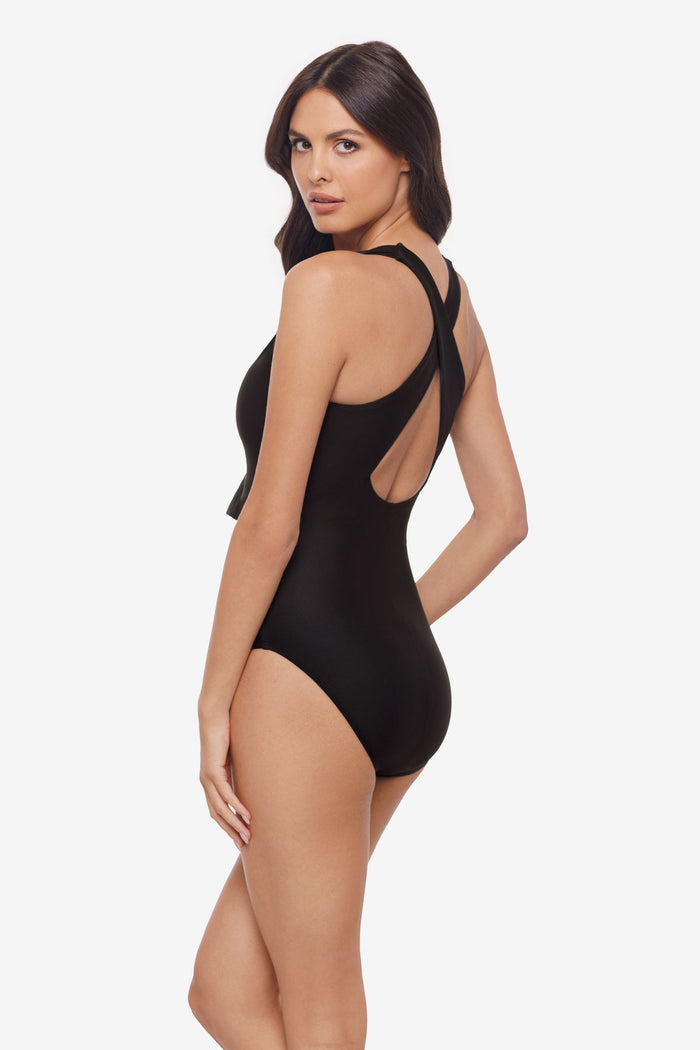 Woman turned left wearing a black one-piece swimsuit