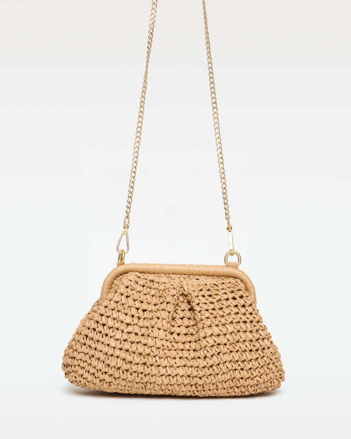 Off-model front view of the Harmony Bag in natural with the gold chain crossbody strap fully extended, on a white background.