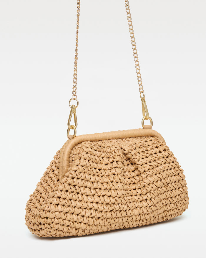 Angled view of the Harmony Bag in natural with the gold chain strap showing the side profile and frame clasp detail.