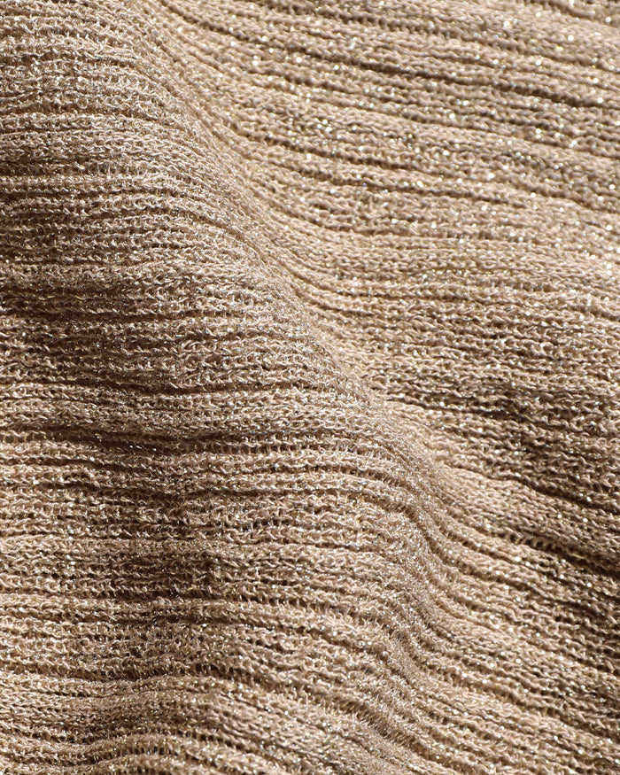 Close-up of the LSPACE Heart Of Gold Skirt in metallic gold, showing the ribbed open-knit texture with metallic gold shimmer thread detail.
