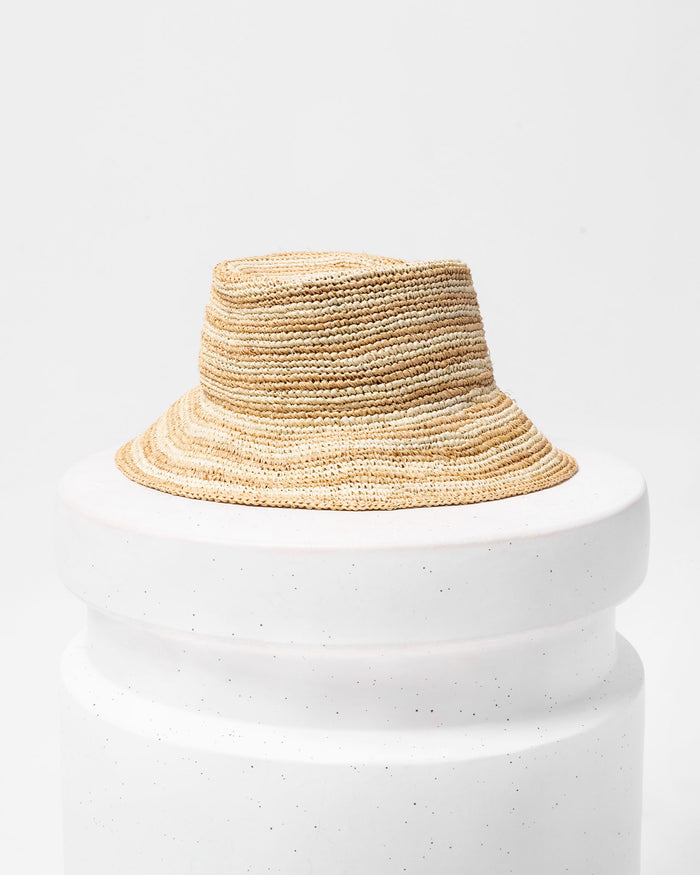 Off-model image of the Isadora Bucket Hat in stripe on a white pedestal.