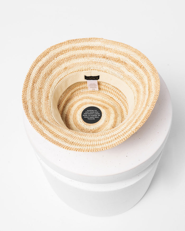 Top-down interior view of the Isadora Bucket Hat in stripe showing the stripe pattern inside, displayed on a white pedestal.