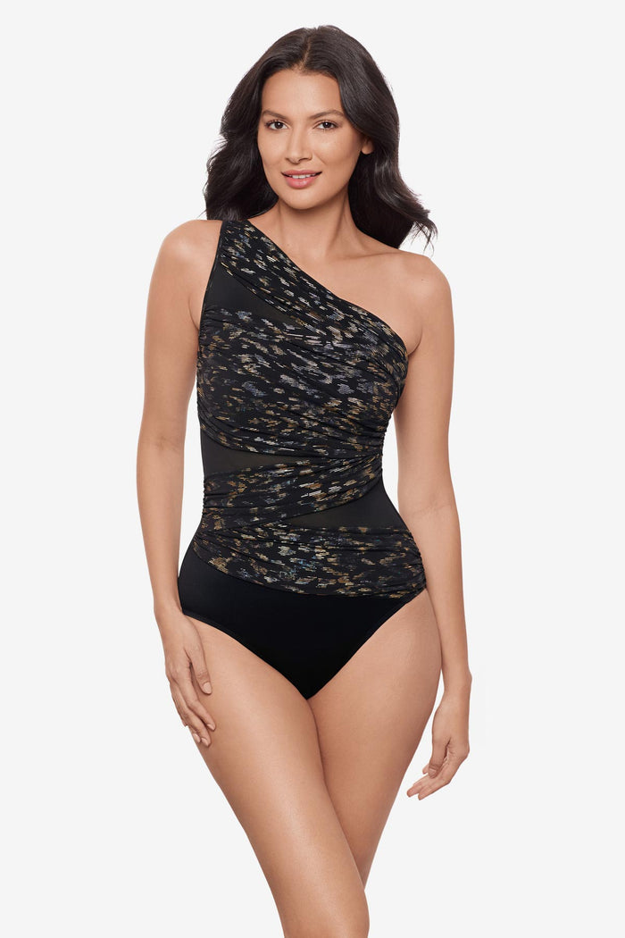 Woman wearing a one shoulder sparkly black one-piece swimsuit