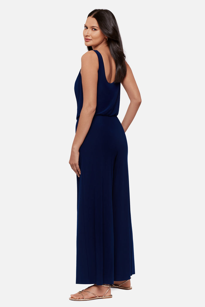 Woman turned left wearing a navy-blue sleeveless romper