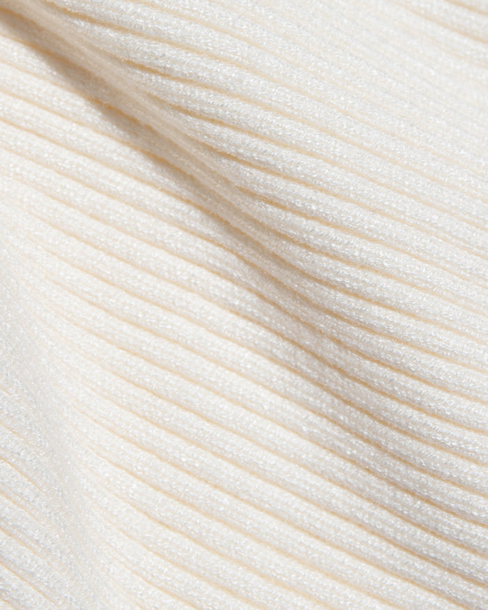 LSPACE Jet Set skirt in cream, close-up detail view of ribbed knit fabric, off-model.