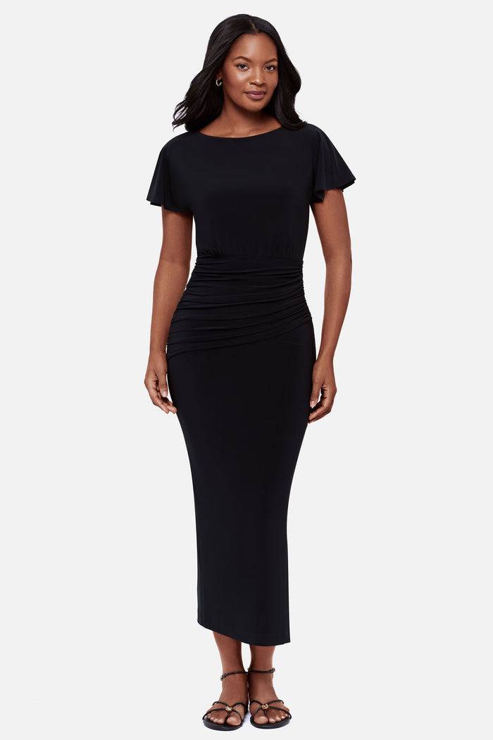 Woman wearing a black short sleeve full length dress