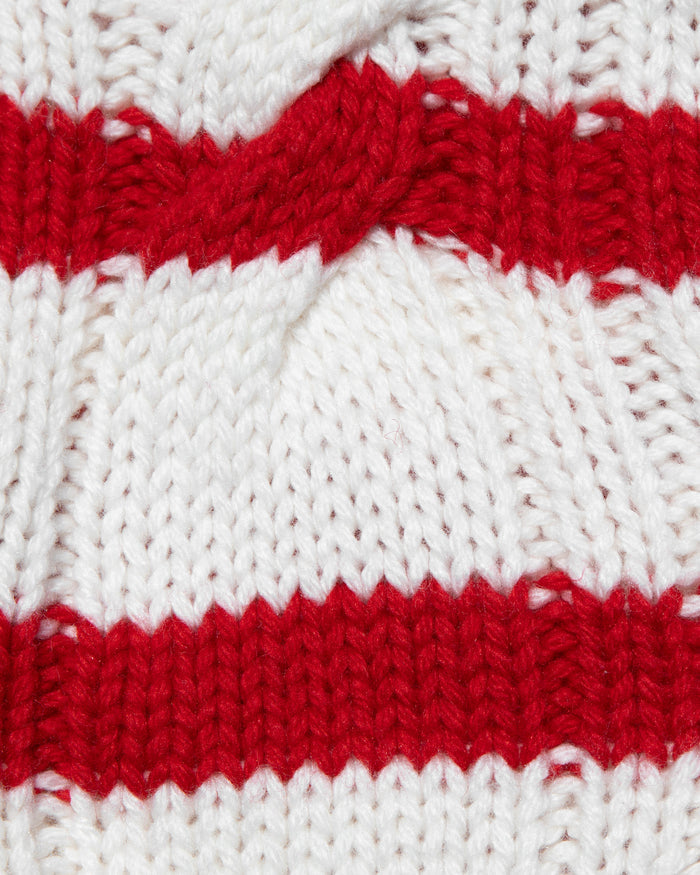 Close-up of the LSPACE Kensley Pullover in cream flame, highlighting the cable-knit texture with alternating cream and red horizontal stripes.
