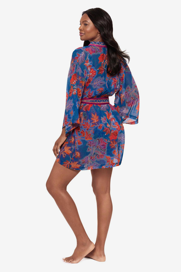 Woman turned left wearing a multicolor floral kimono swim cover up