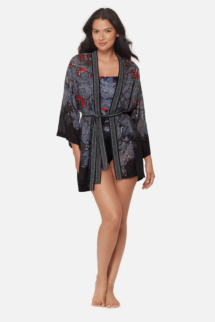 Woman wearing a multicolored abstract floral printed kimono swim cover up