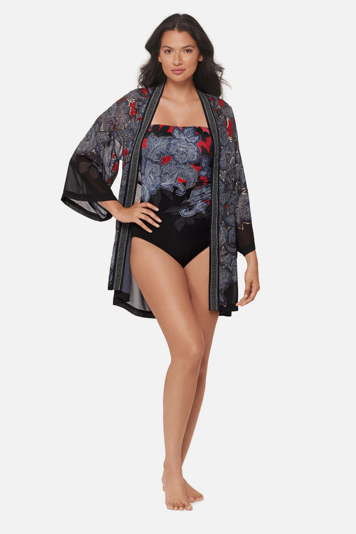 Woman wearing a multicolored abstract floral printed kimono swim cover up