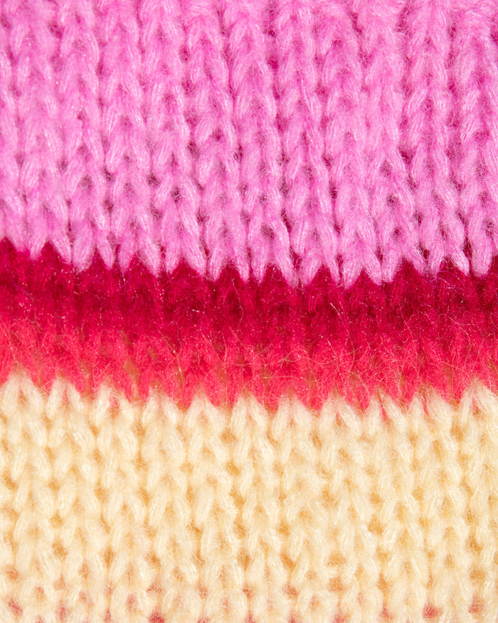 Close-up of the LSPACE Lido Cardigan in catch some rays, highlighting the chunky knit texture with horizontal stripes in pink, red, and cream.