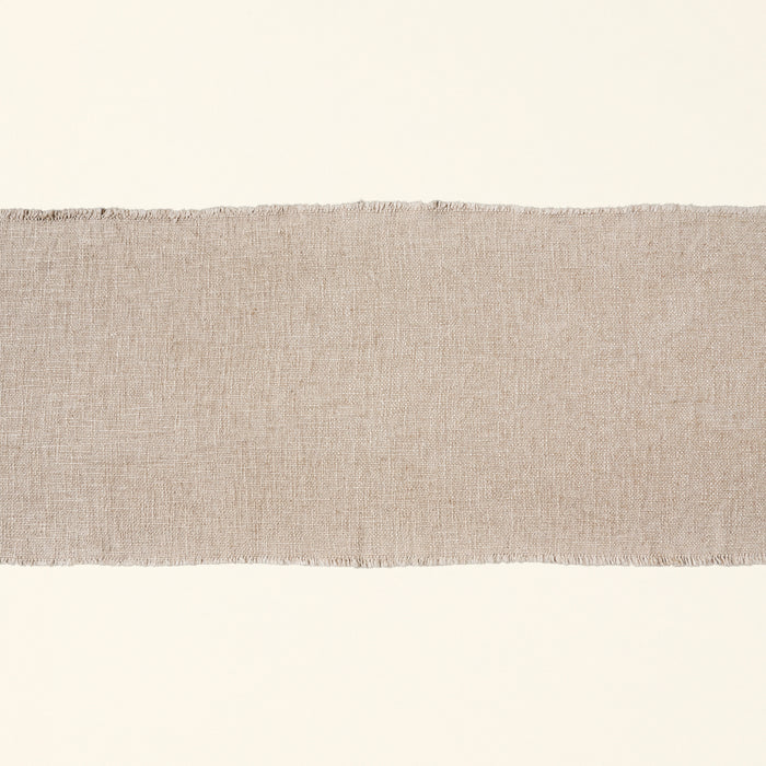 Linen blend table runner with frayed edges.