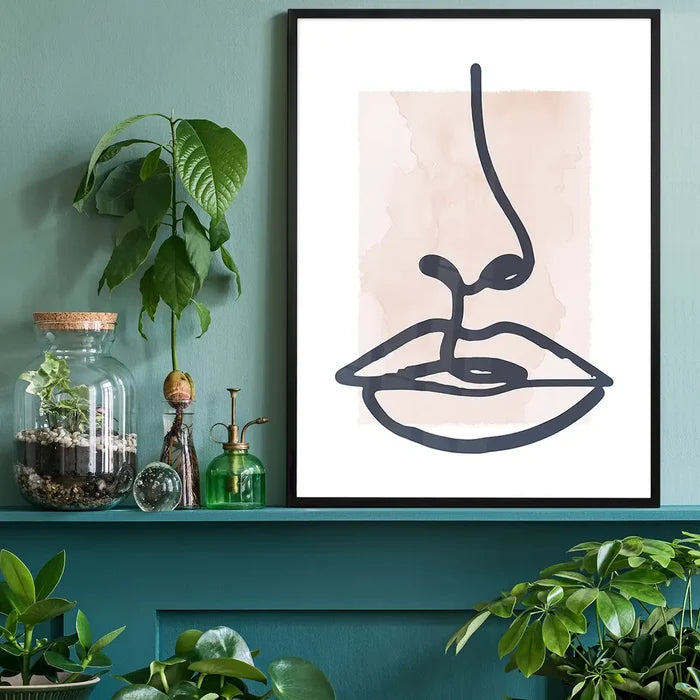 Lips Drawing Watercolour Style Print black framed on a living room shelf