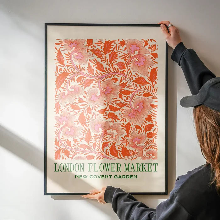 London Flower Market Covent Garden Print being hung on a wall in a black frame
