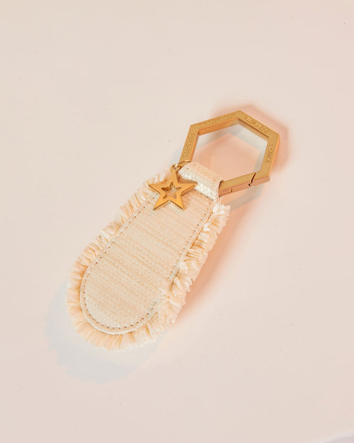 Off-model image of the LSPACE x Lindsay Albanese TOPTOTE in a natural colorway on a blush background.