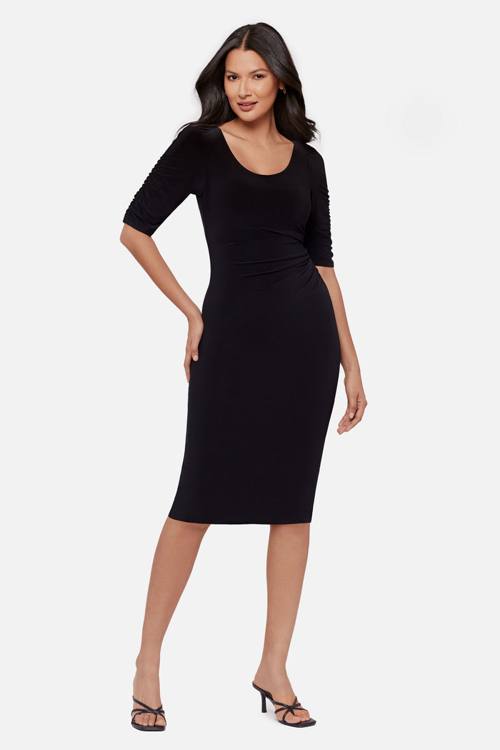 Woman wearing a black half sleeve mid length dress