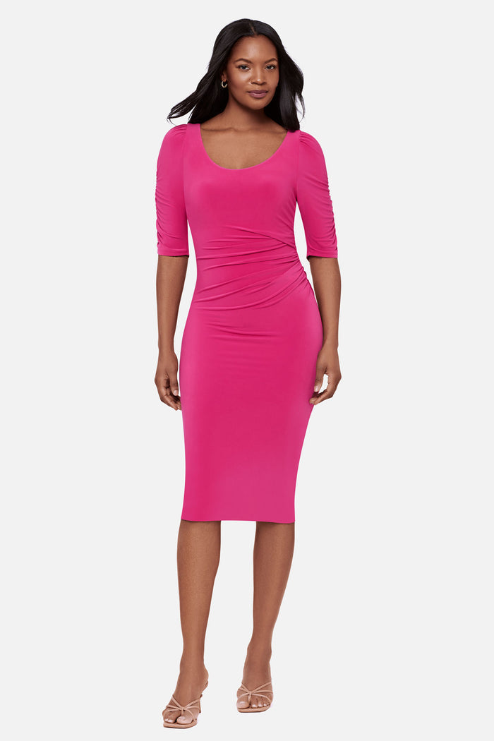 Woman wearing a pink half sleeve mid length dress